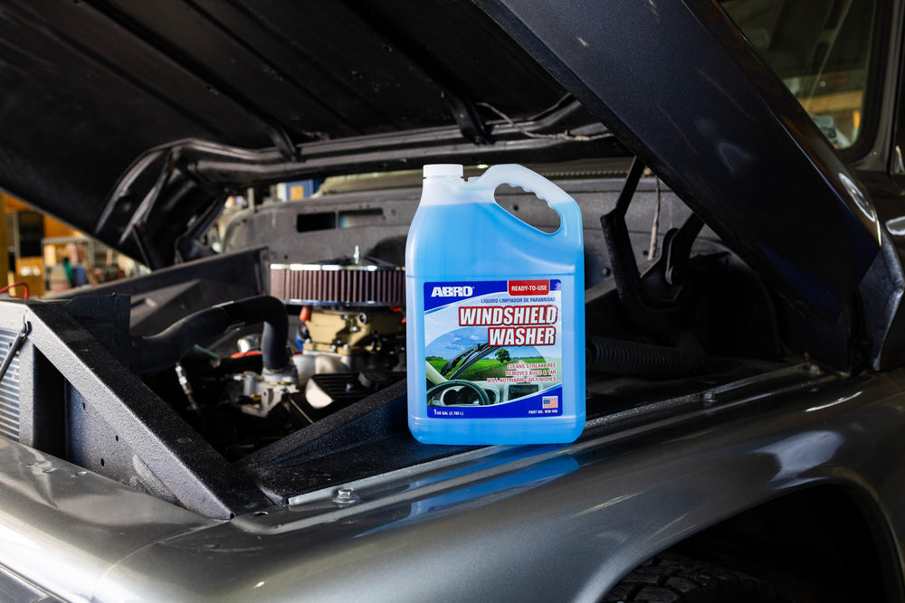 ABRO windshield fluid bottle shows clear finish after cleaning.