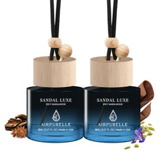 AirPurelle car air freshener hanging two-pack bottles with long-lasting sandalwood aroma.