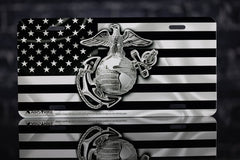 Airstrike USMC license plate shows a black flag design with bold colors for curb appeal.