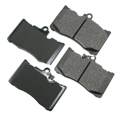 Akebono ProACT Ultra-Premium ceramic brake pads in grey, delivering quiet braking and low dust.