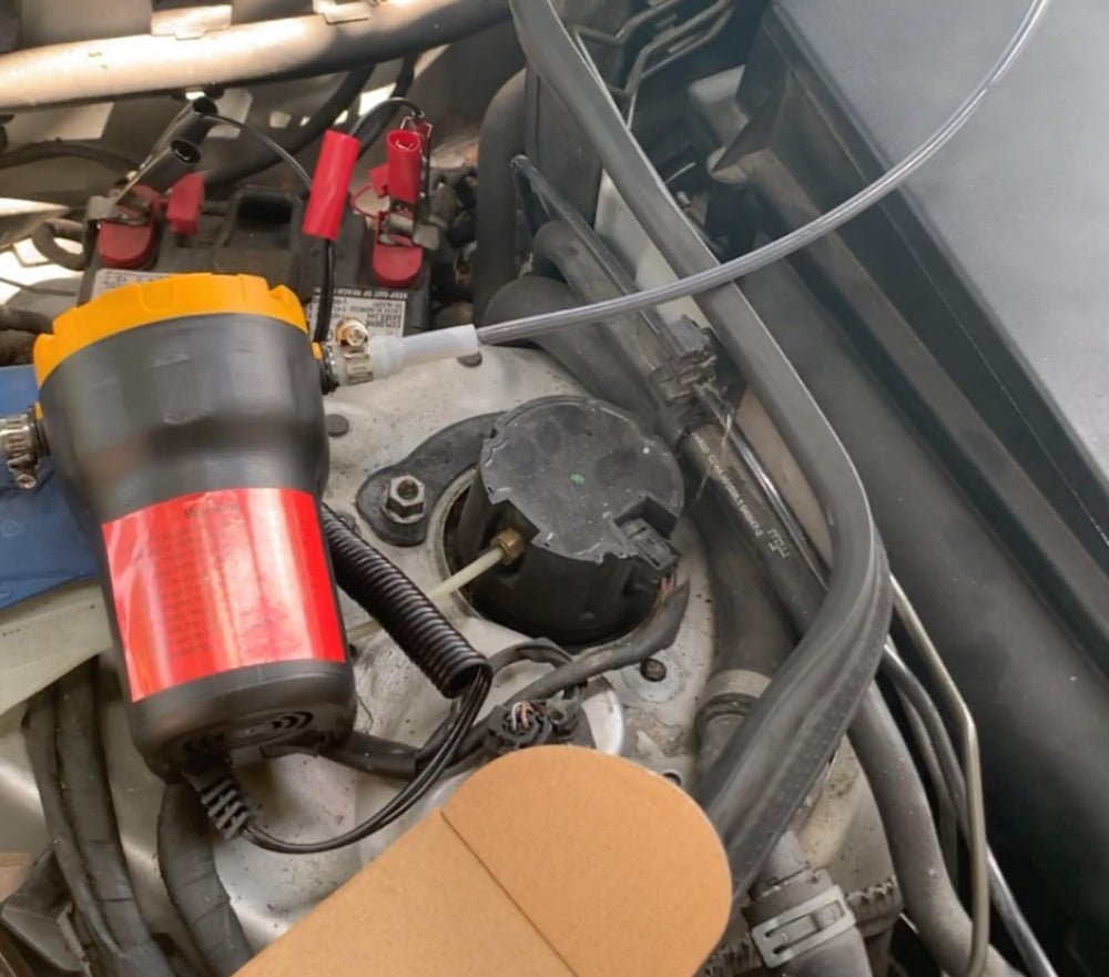 Amarine Made oil pump with battery clamps for easy power source.