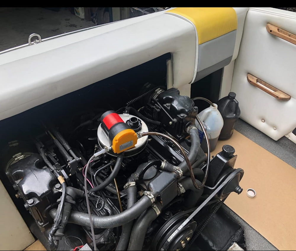 Amarine Made oil pump with transfer hose for quick fluid moves.