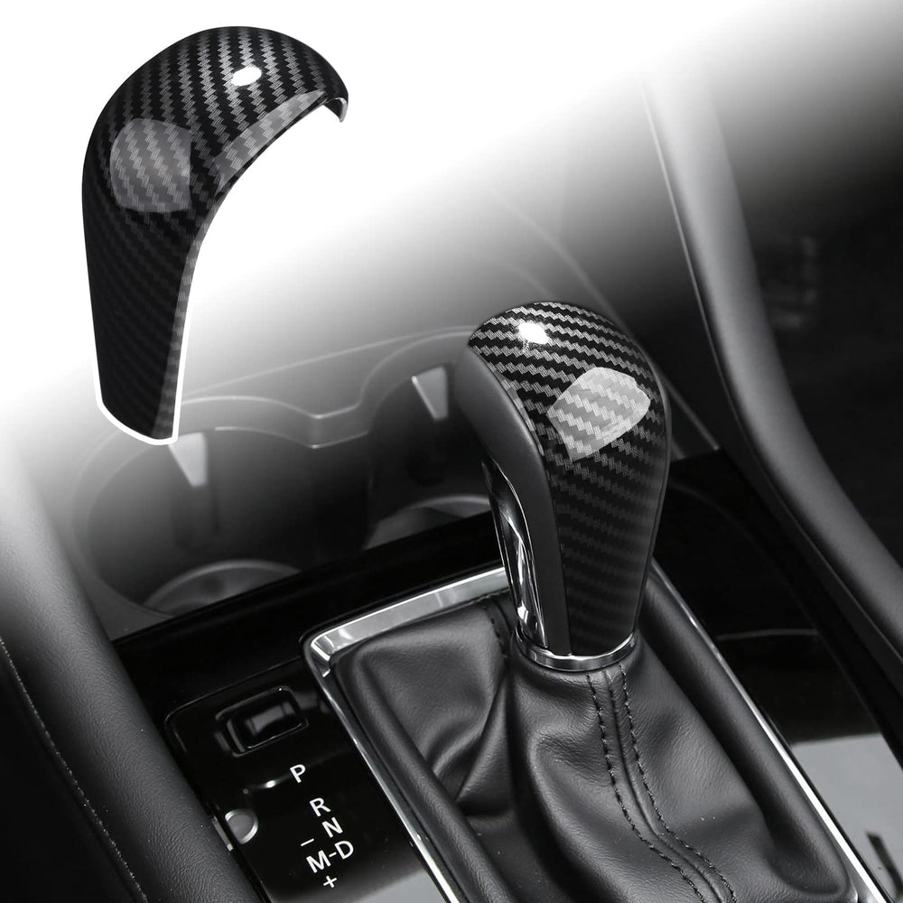 ANFOKAS gear shift knob cover in carbon fiber style enhances cockpit aesthetics and protects the knob.