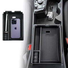 ANFOKAS armrest box for Kia Sportage NQ5 keeps coins and cards neatly organized.