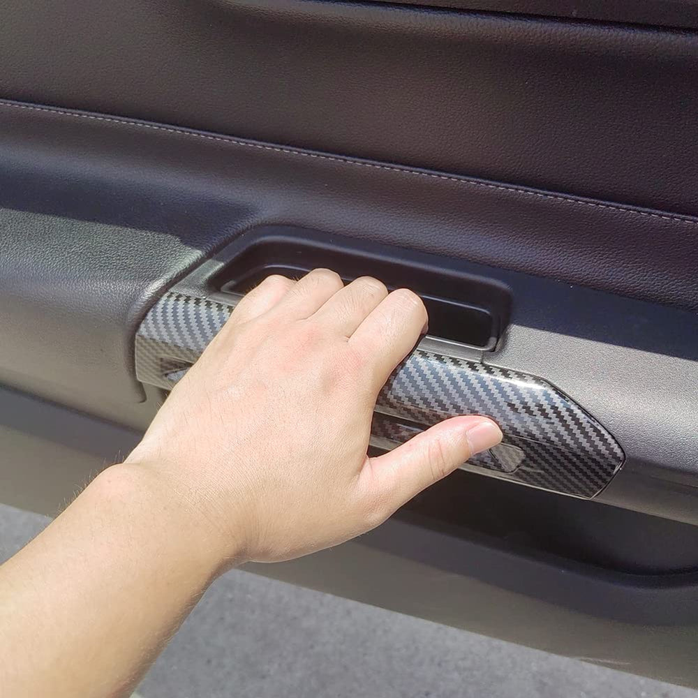 AOKIO Mustang carbon-style handle cover installed on door panel demonstrates seamless fit.