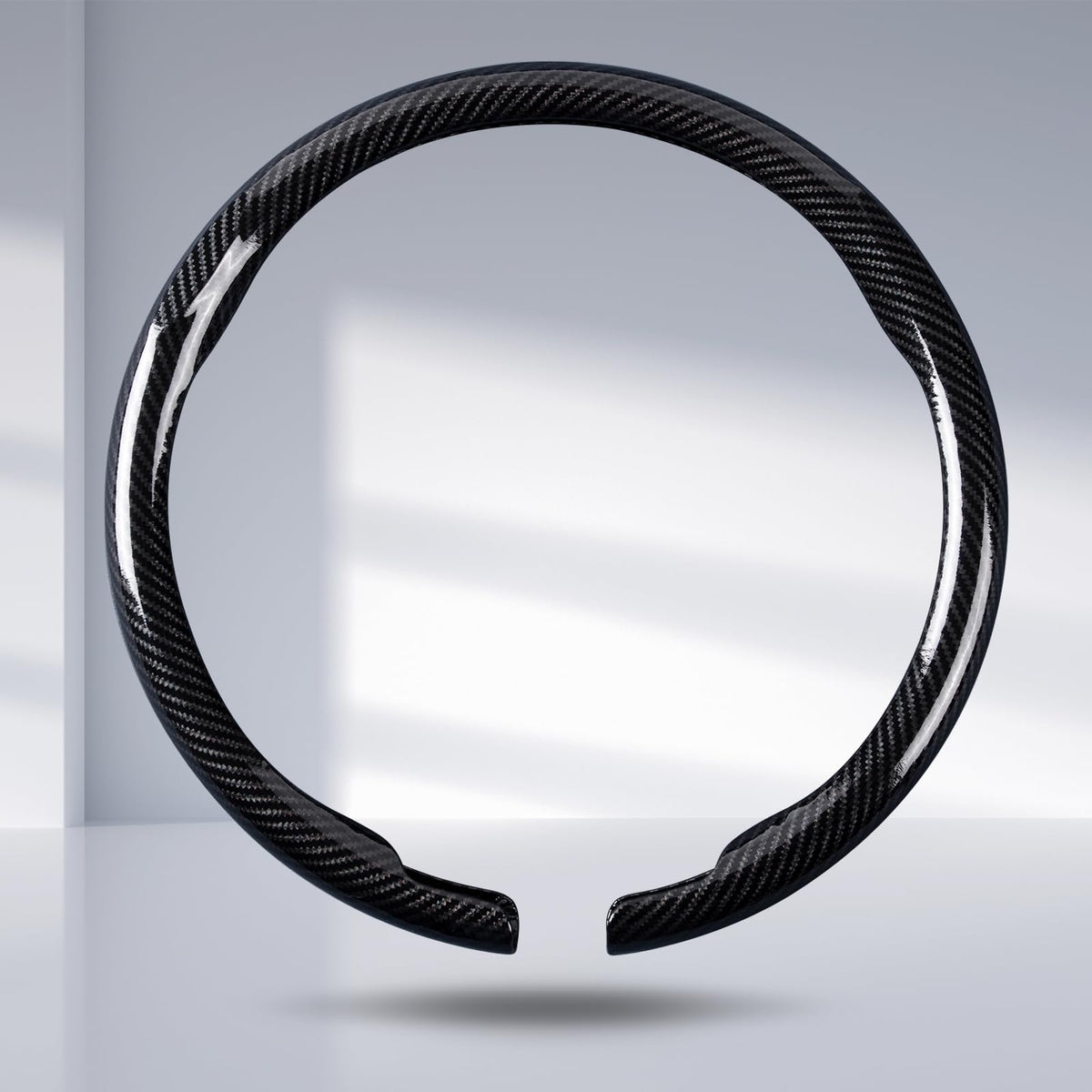 Aotoyou carbon fiber steering wheel cover clip-on in glossy black enhances grip and style.