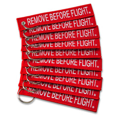 Apex Imports AIXEPA remove-before-flight keychain in red and white for travel reminders.