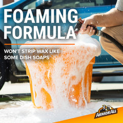 Soap is dispensed into a bucket for car washing prep.