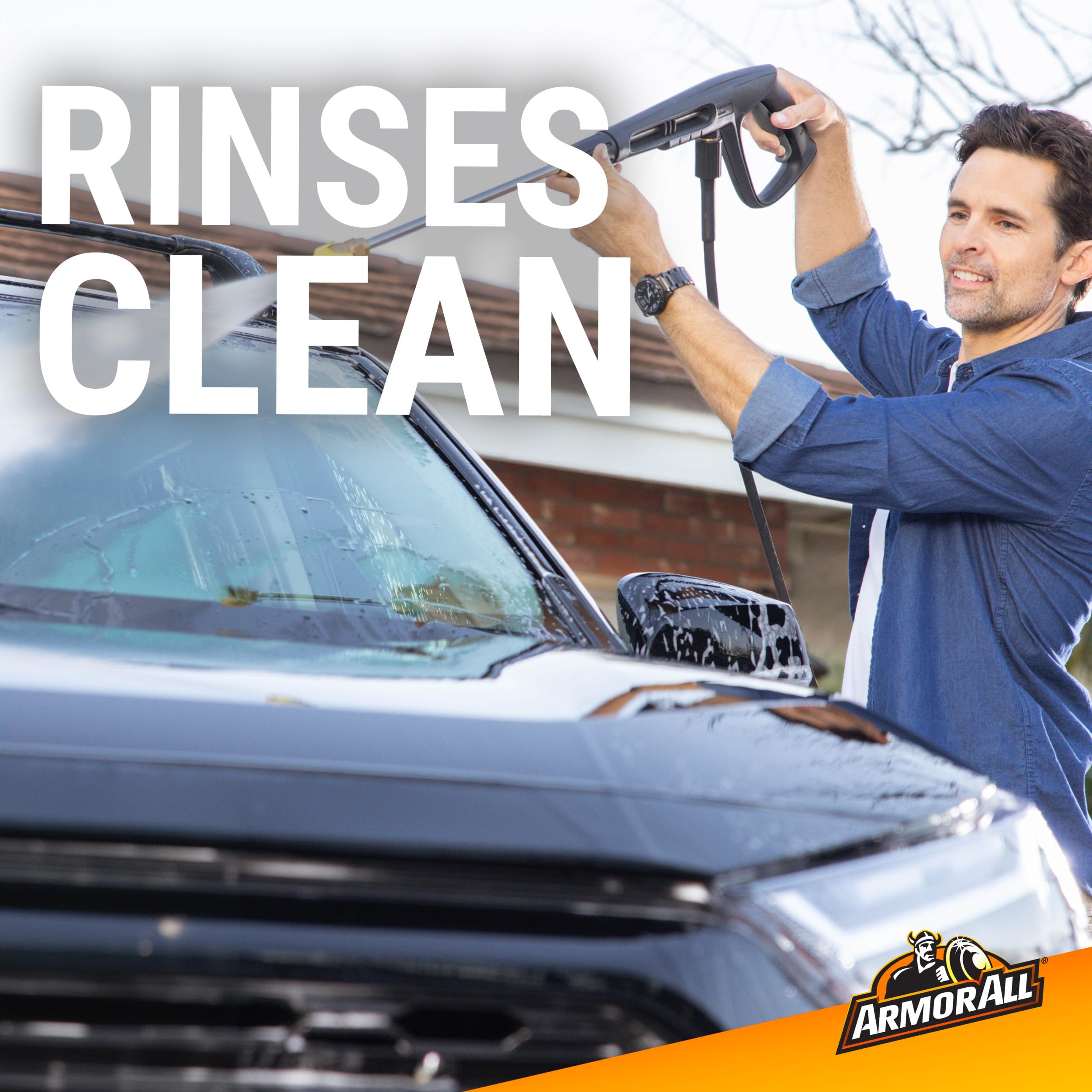 Suds cover a vehicle panel during a thorough wash.