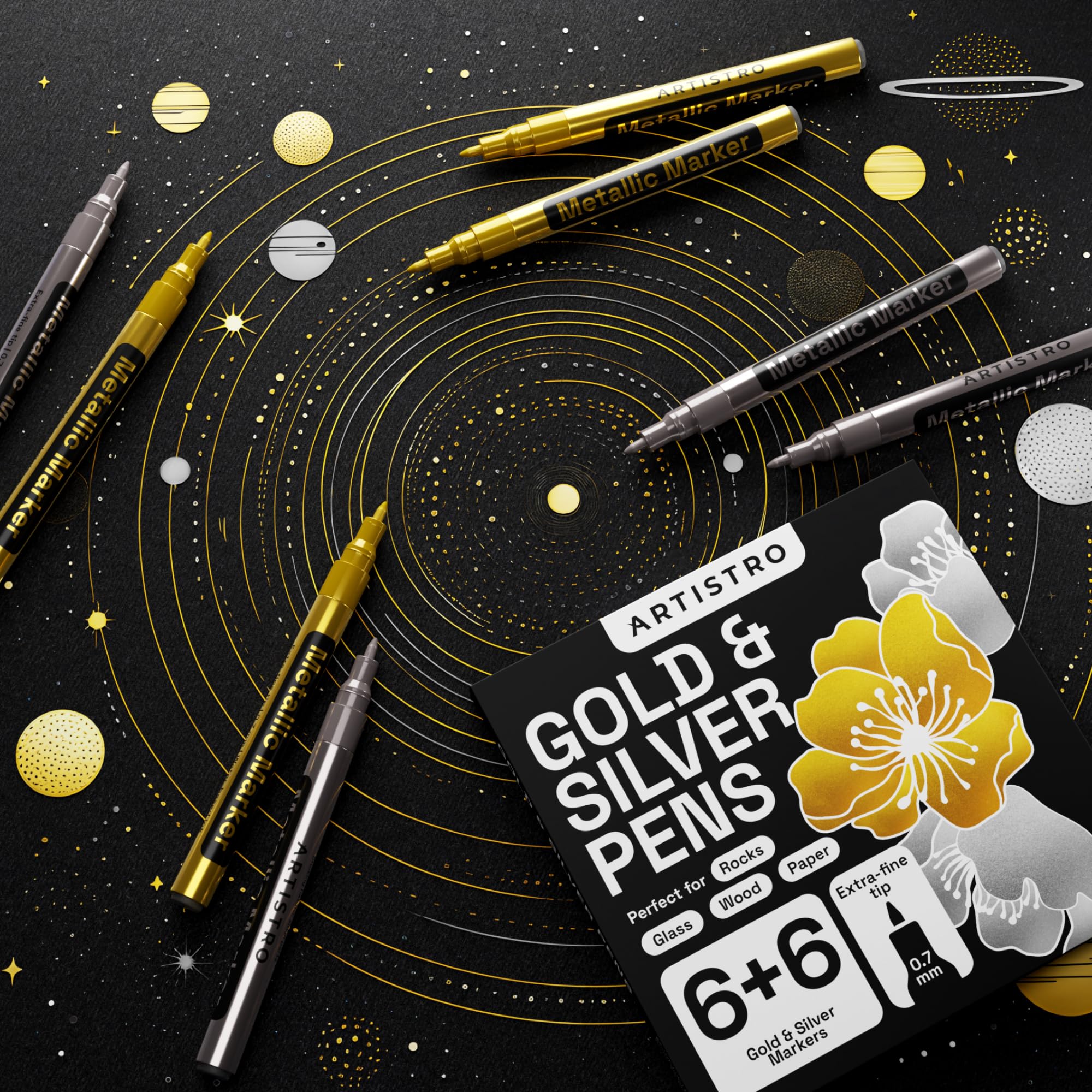 Artistro gold paint pen on rock preserves fine lines for outdoor use.