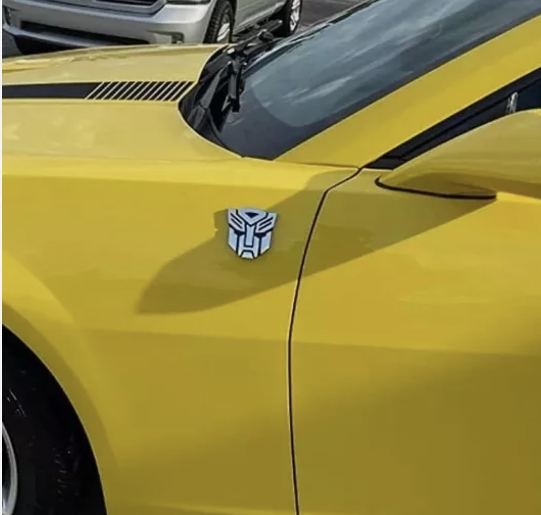 Autogem badge with 3M backing enables quick peel-and-stick installation.