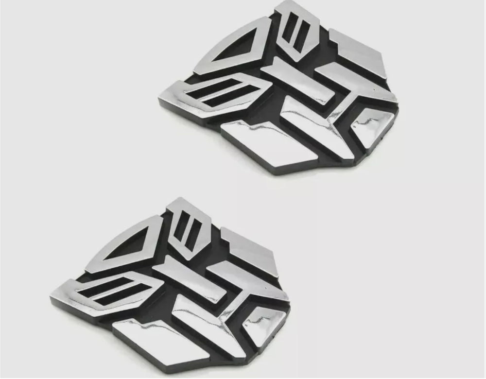 Autogem transforming robot emblem with chrome finish enhances exterior style.
