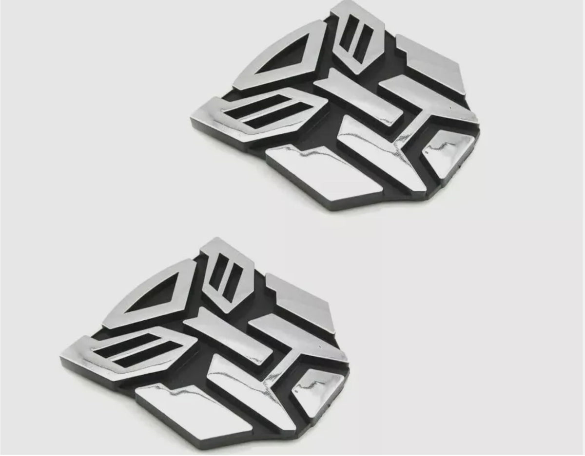 Autogem transforming robot emblem with chrome finish enhances exterior style.