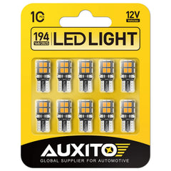 AUXITO 194 amber yellow LED bulb close-up showing 14 SMD LEDs for bright dome light