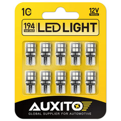 AUXITO 194 LED blue bulb closeup showing uniform 360° brightness for car interior use