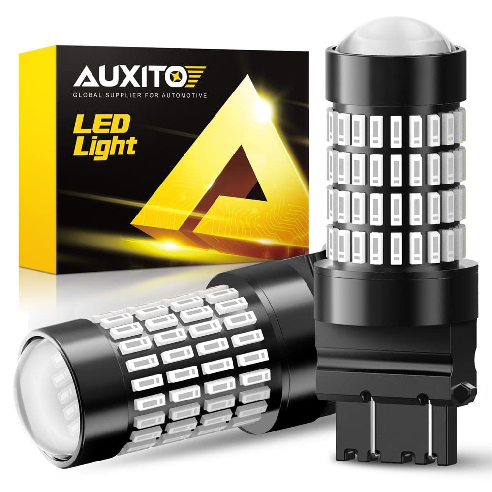 AUXITO upgraded 3157 red LED bulbs with projector for bright brake-light visibility.