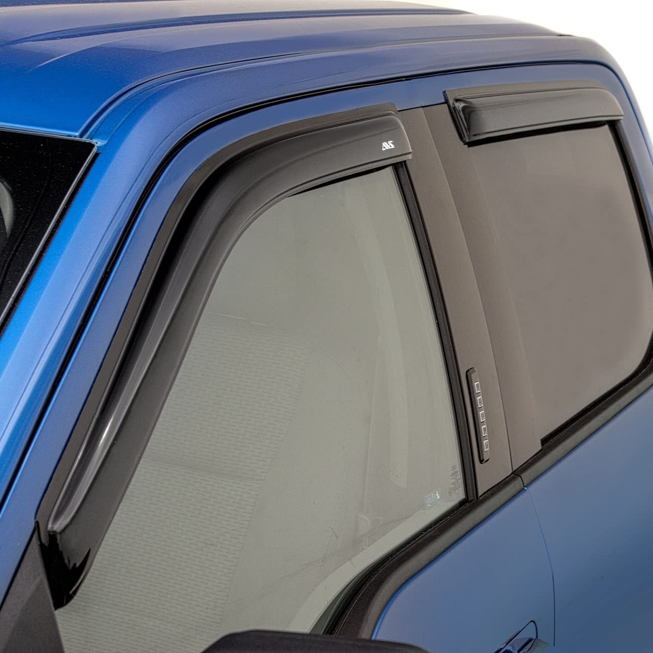 Auto Ventshade ventvisor on a crew cab truck deflects rain yet allows airflow.