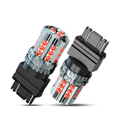AZQOP 3157 LED brake light bulb close-up with bright red illumination.
