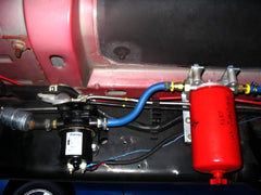 Baldwin BF1212 side view, red spin-on design for easy handling and replacement.