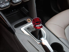 Bashineng skull shift knob in car red, shows custom modification potential