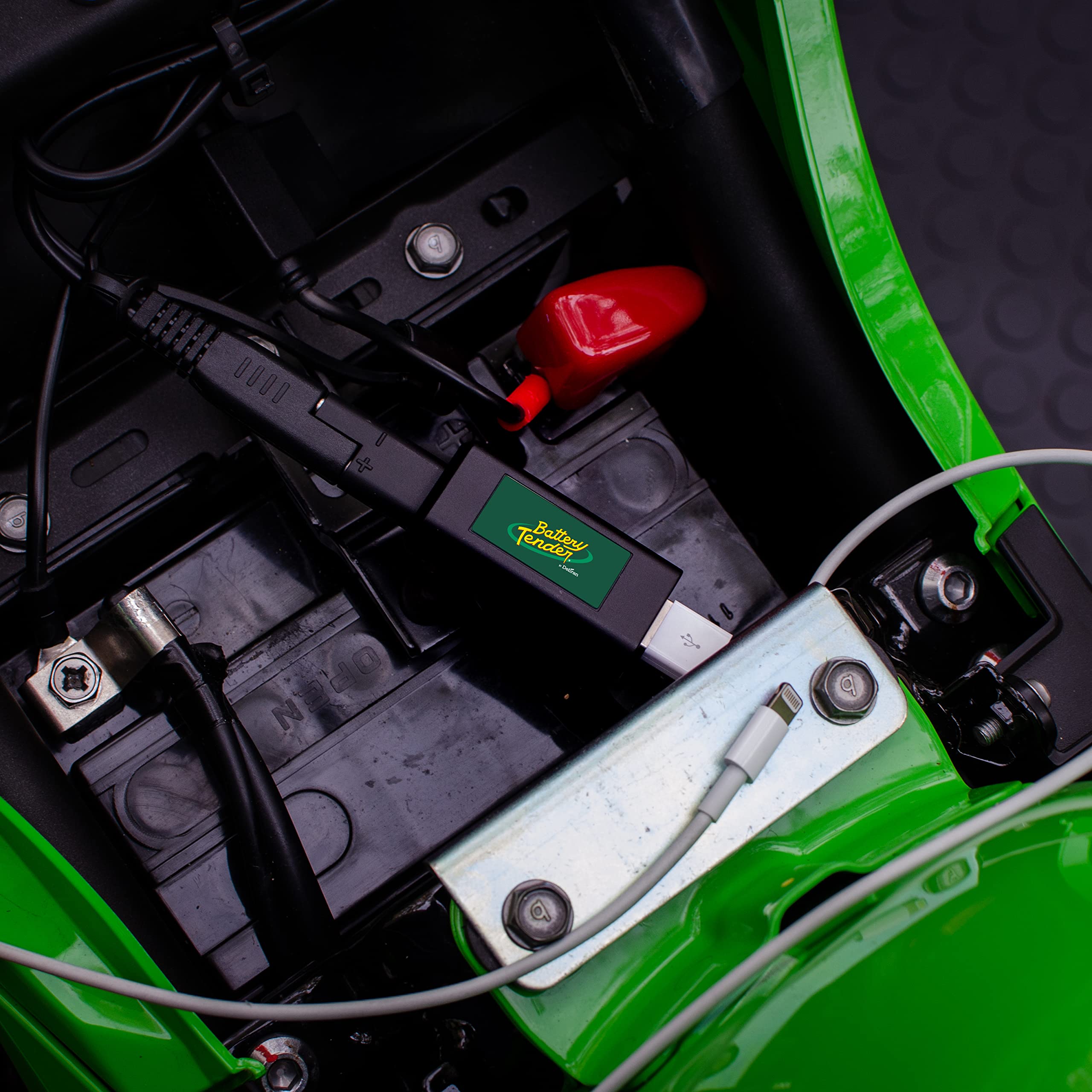 Battery Tender adapter side connection showing SAE quick disconnect for 12V charging.