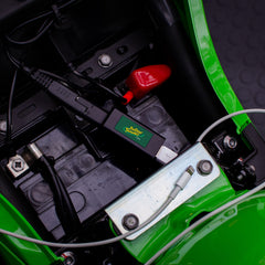 Battery Tender adapter side connection showing SAE quick disconnect for 12V charging.