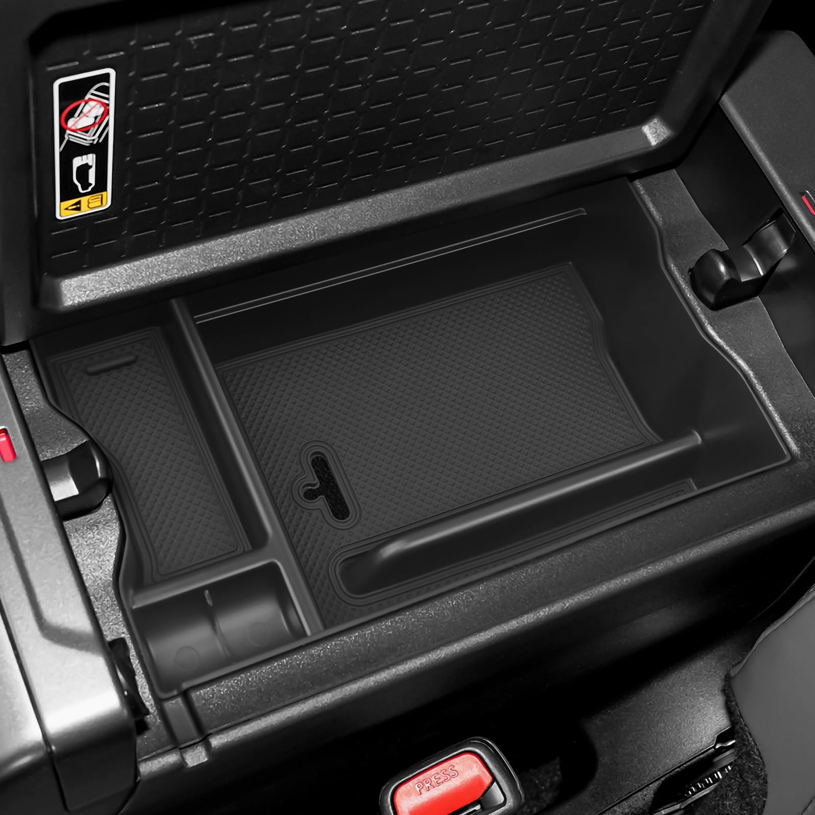 Non-slip mats keep small items from sliding in the console tray