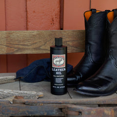 Bickmore Leather Oil applied with cloth to renew leather softness.