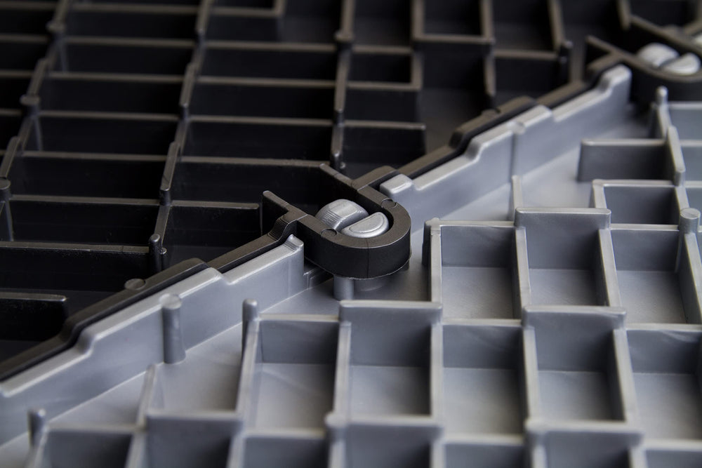Big Floors GarageTrac Diamond pattern tile providing non-slip traction in workshop.