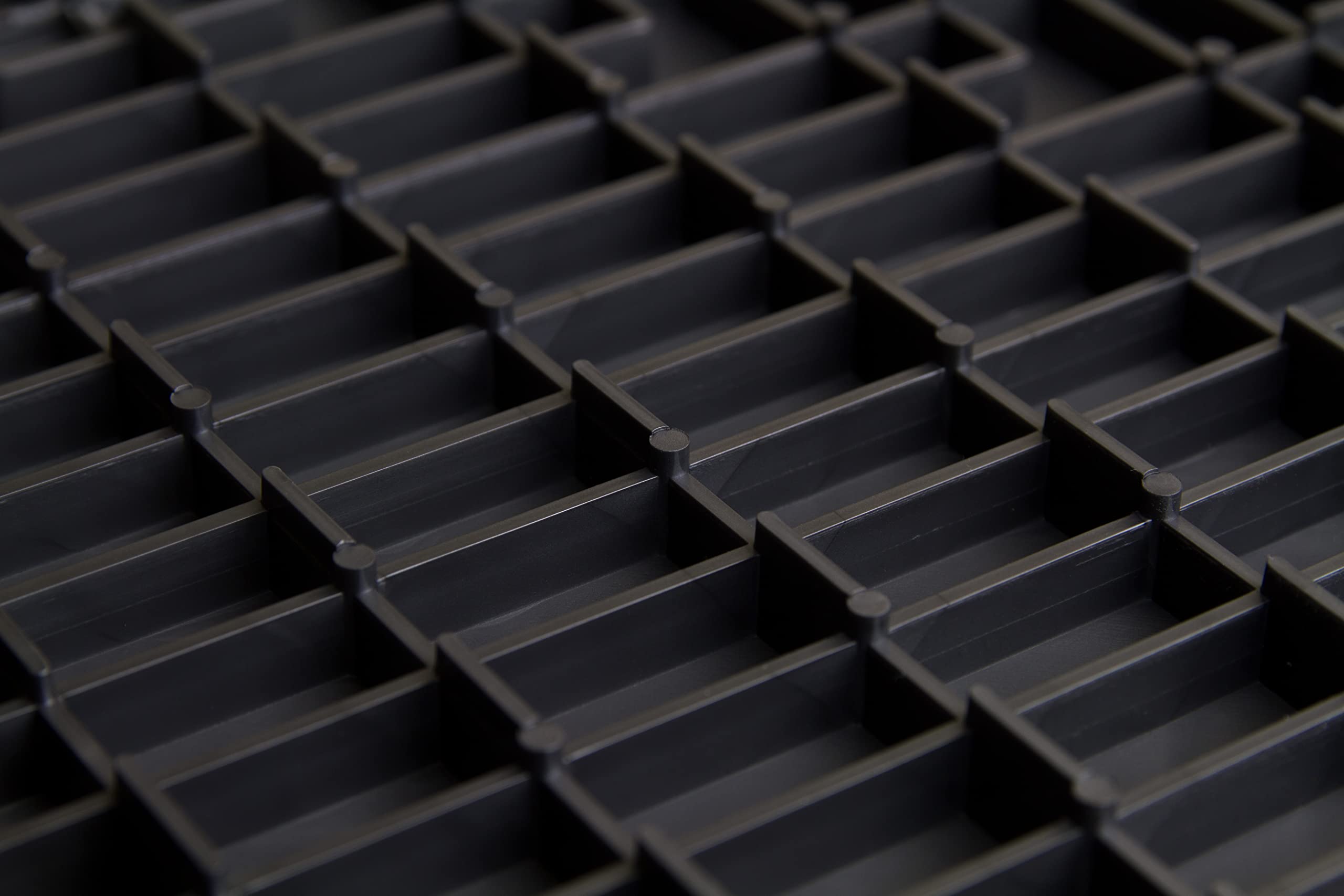Big Floors GarageTrac tile made of durable copolymer for heavy-duty garage use.