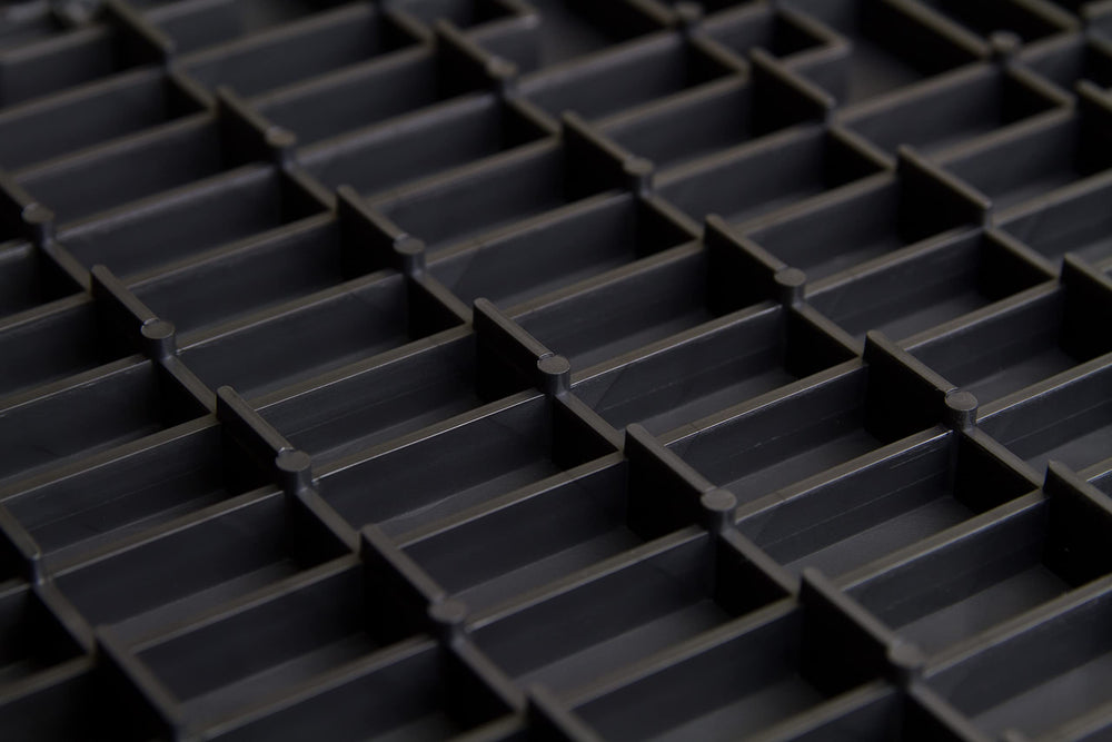 Big Floors GarageTrac tile made of durable copolymer for heavy-duty garage use.