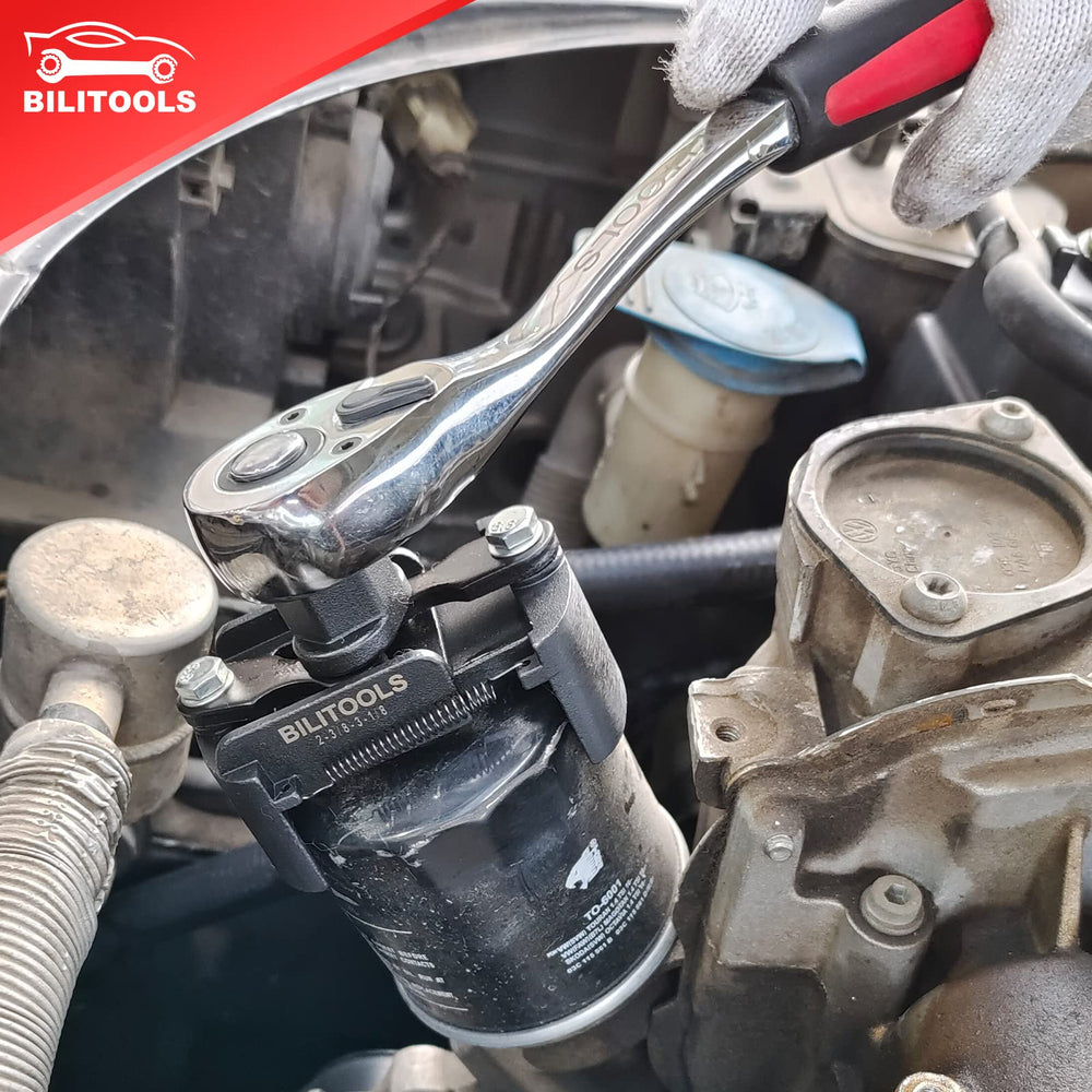 BILITOOLS wrench gripping oil filter during installation for secure removal.