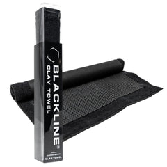 Blackline Clay Towel polymer layer close-up lifting tar from paint for surface decontamination.