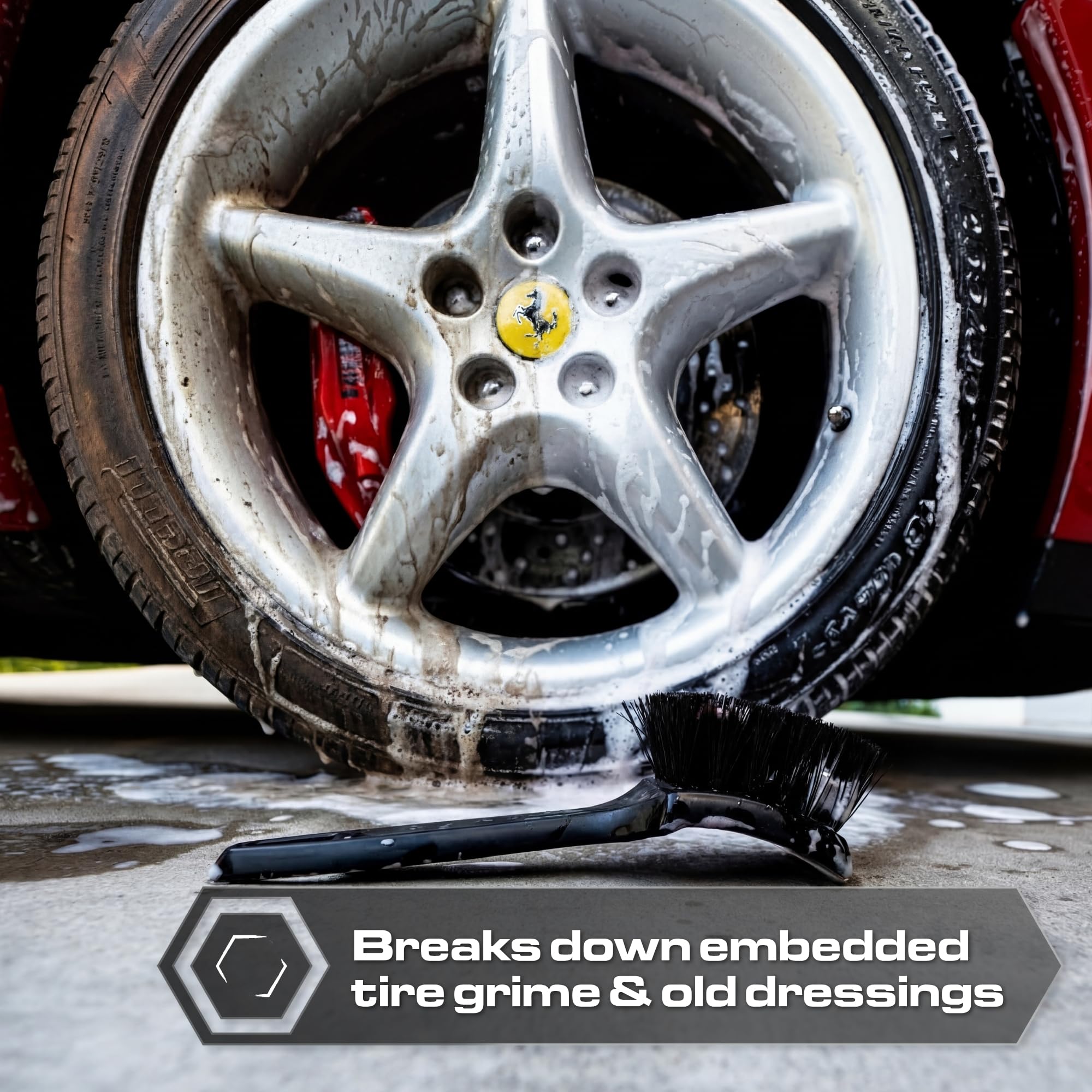 Blackline stiff bristle brush cleaning rubber mats and removing ground-in debris.