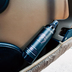Close-up of label highlighting teakwood scent and active odor eliminator