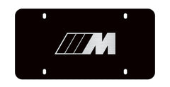 BMW M logo marque plate in stainless steel with black finish, enhances door sill style and protection.