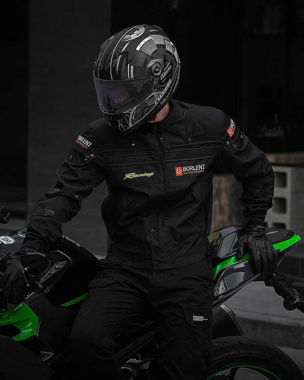 BORLENI motorcycle jacket back view highlights reflective back strip for night visibility.