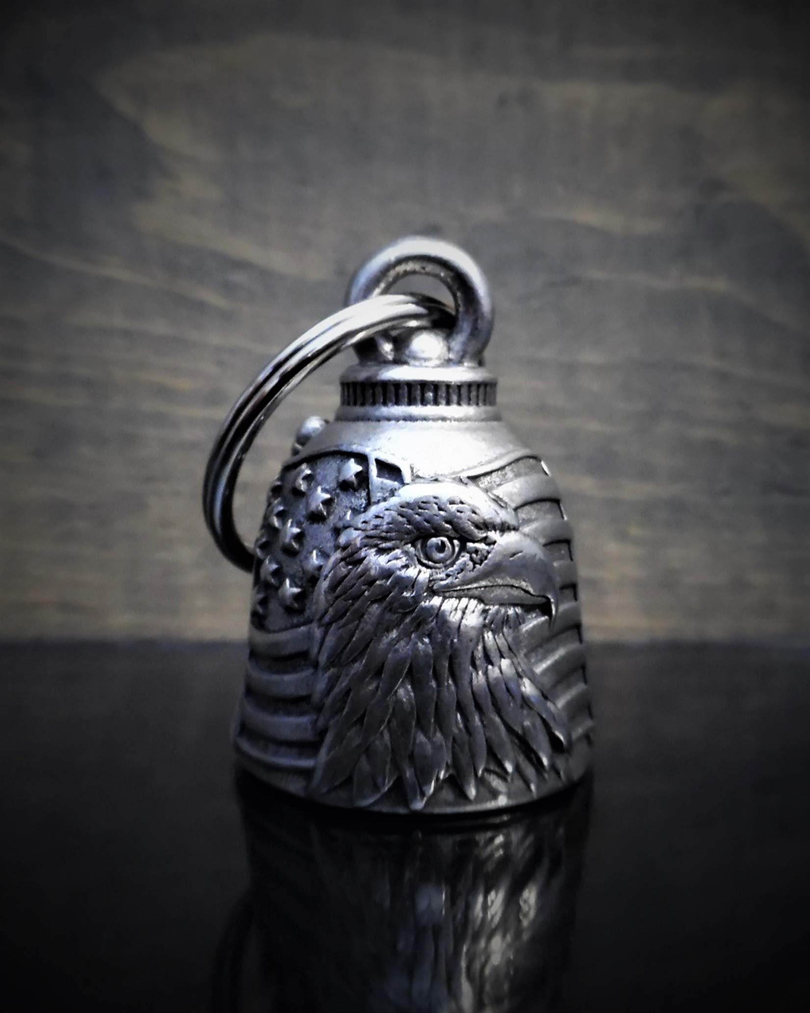 Close-up of Bravo Bells US Flag Eagle engraving, showcasing durable craftsmanship for long rides.