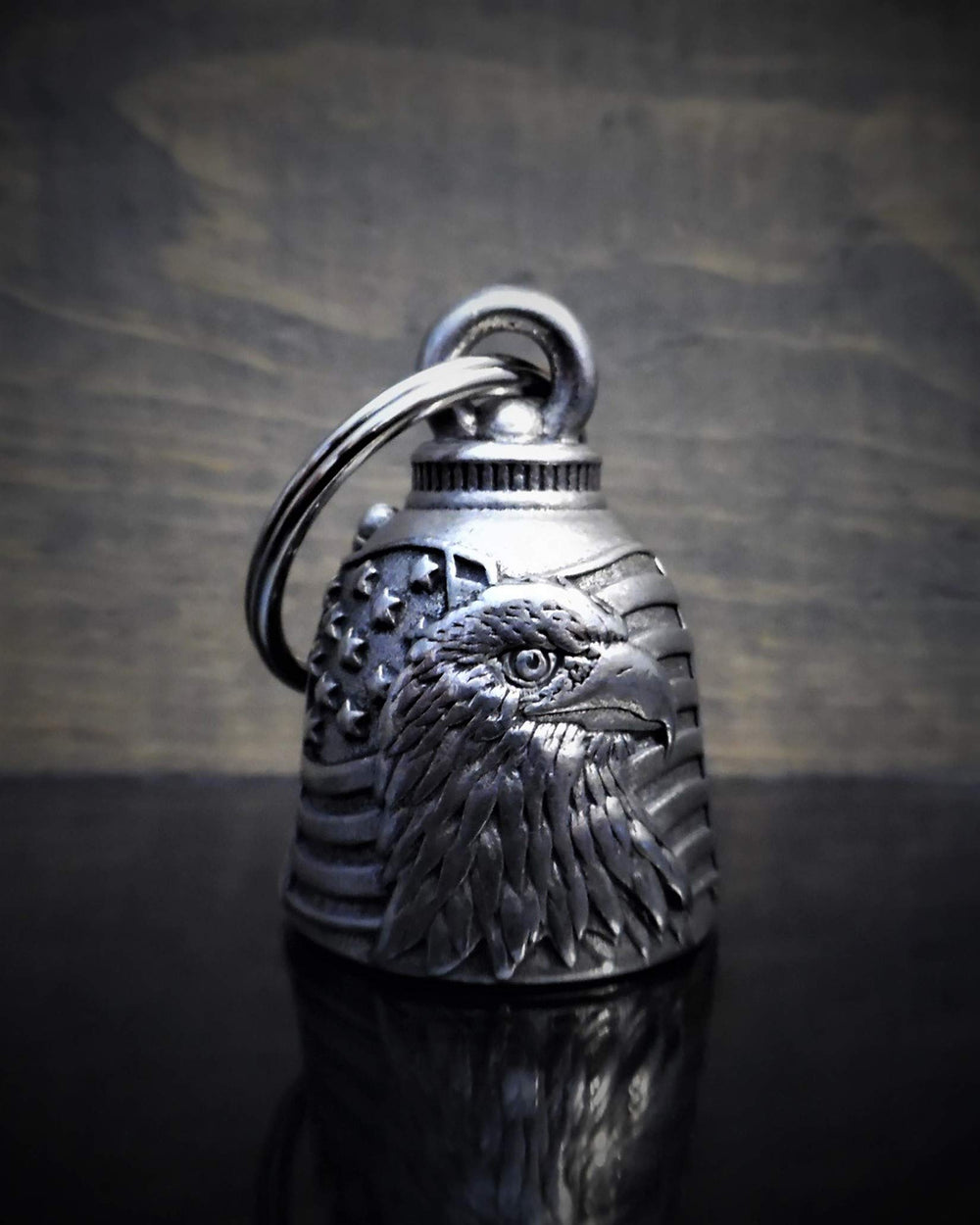 Close-up of Bravo Bells US Flag Eagle engraving, showcasing durable craftsmanship for long rides.
