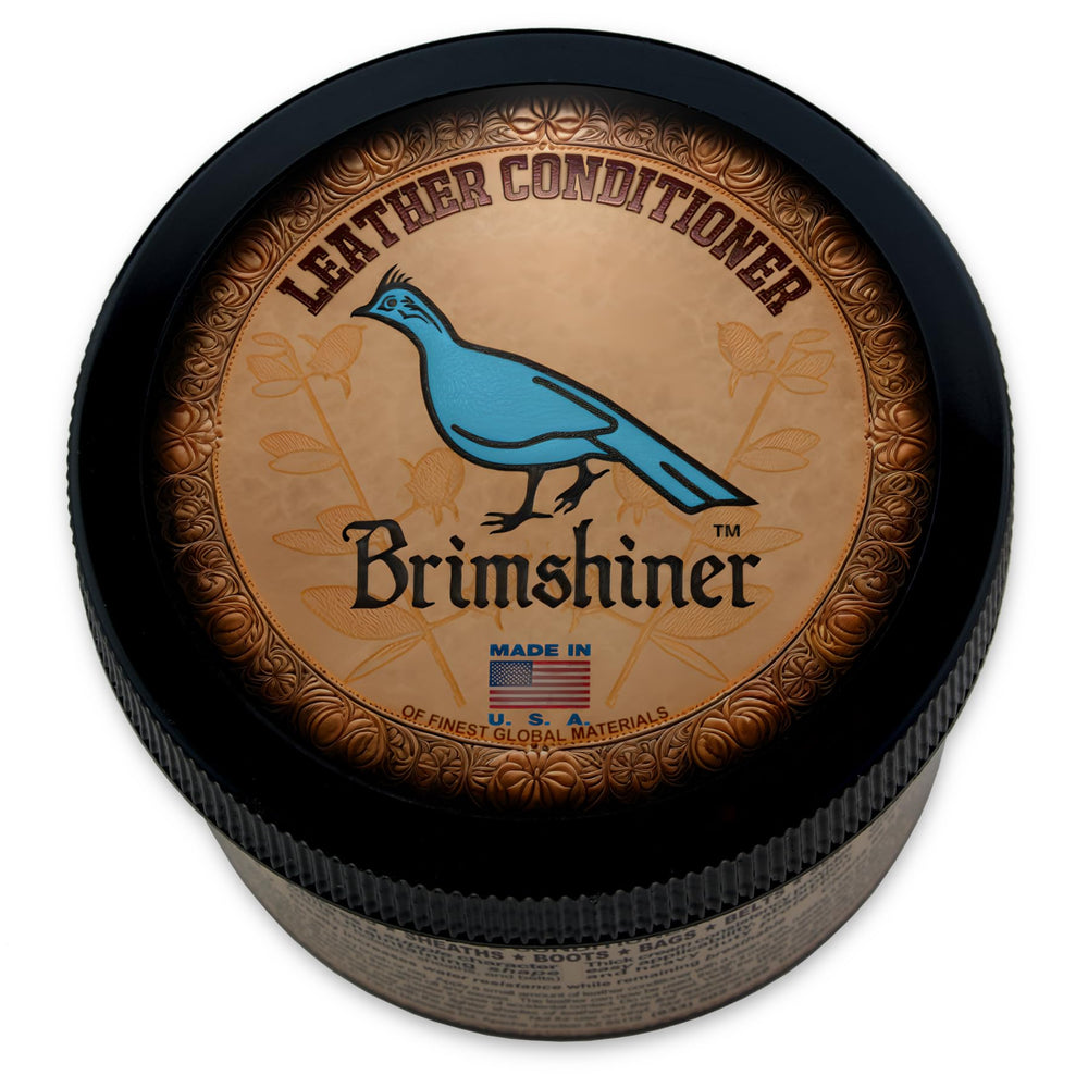 Brimshiner Leather Conditioner bottle pour shows easy application and surface protection.