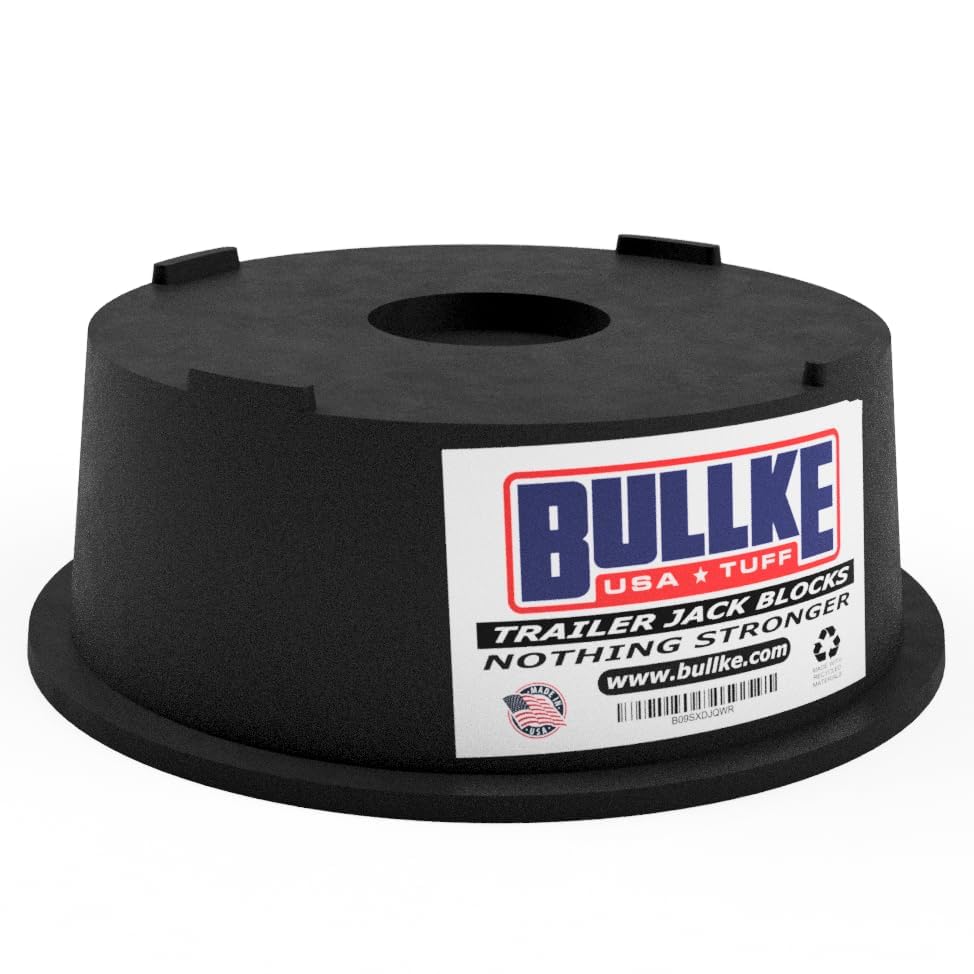 Bullke trailer leveling blocks stacked on uneven ground for RV stability.
