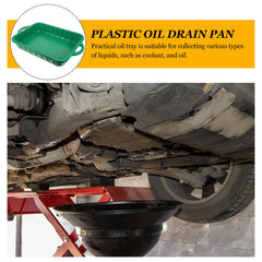 CALLARON green plastic drain pan on a workbench during maintenance.