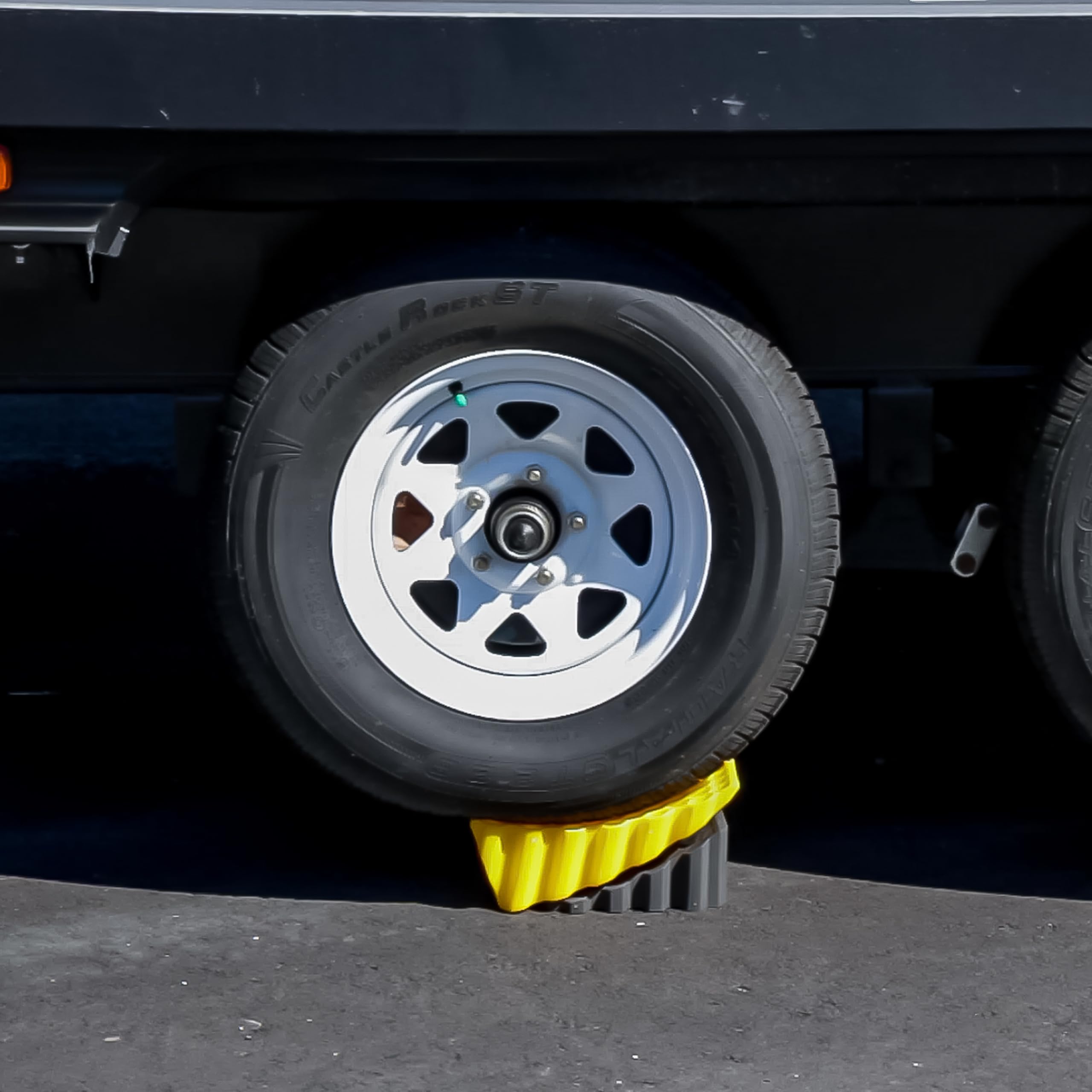 Camco curved leveler lifts up to four inches for stable RV leveling.