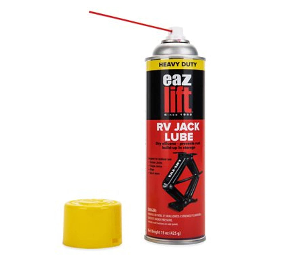Camco EAZ-Lift RV stabilizer jack being lubricated for smooth operation.