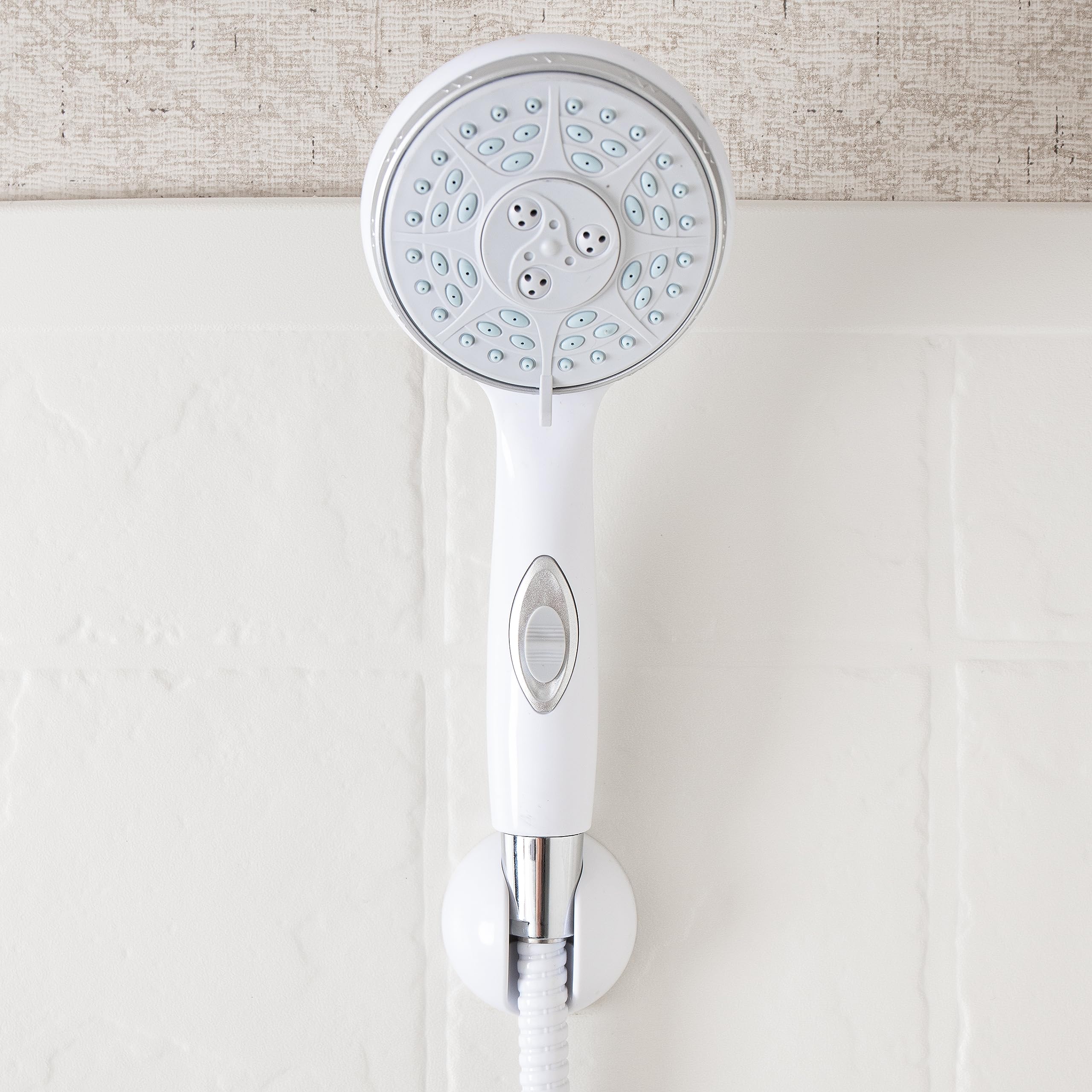 Camco RV shower head on/off switch close-up shows pause control.