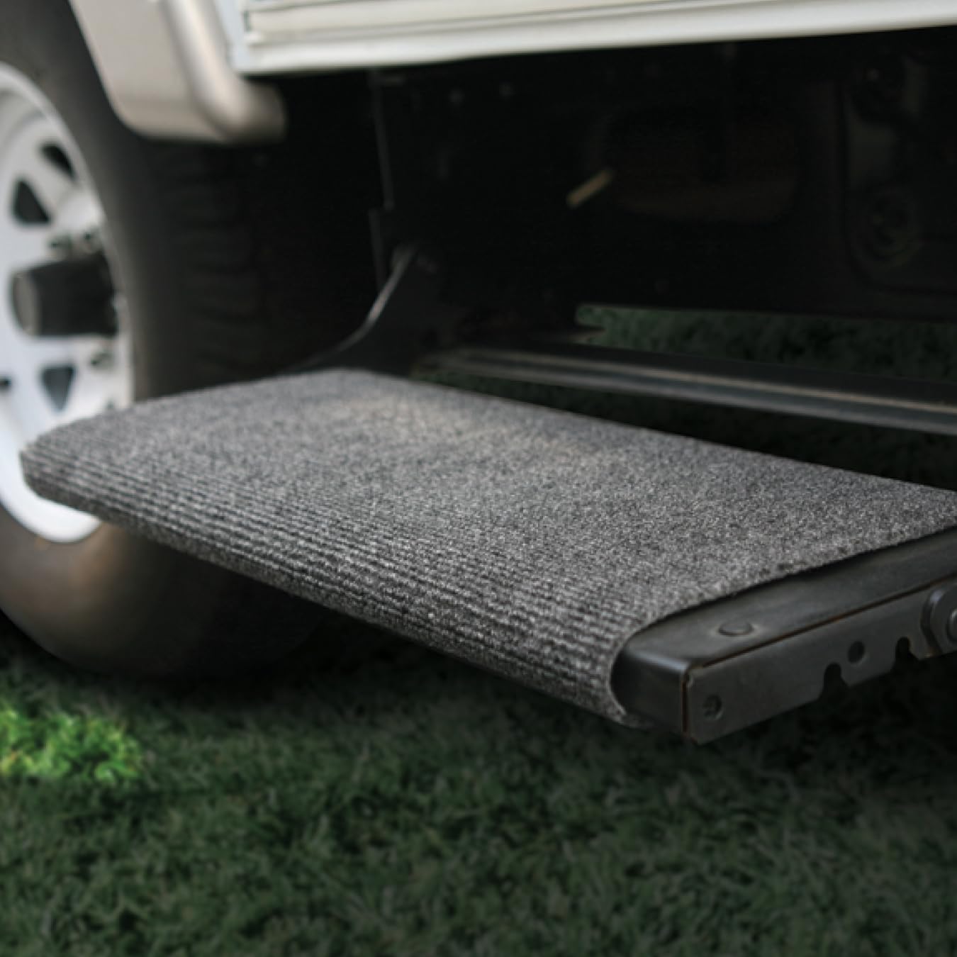 Camco step rug installation side view shows no tools required for easy setup.