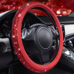 CAR PASS close-up of sparkly crystal rhinestones on the steering wheel cover.
