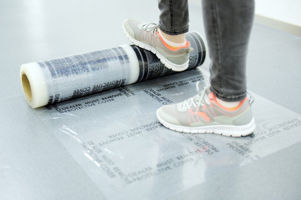CARCAREZ 4 mil protective film unrolled for masking car floors in detailing