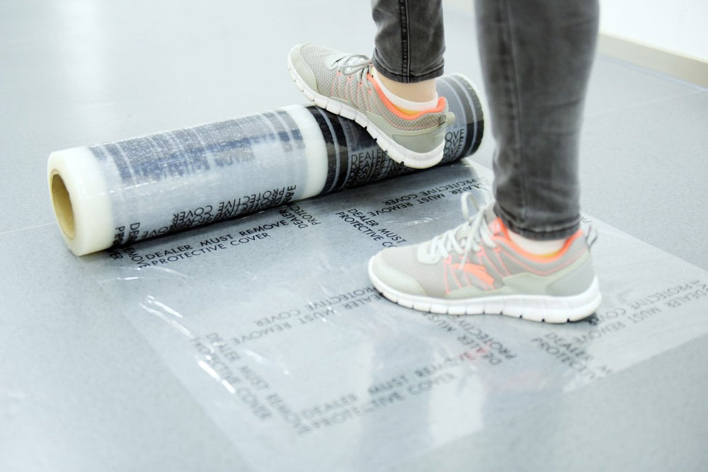 CARCAREZ 4 mil protective film unrolled for masking car floors in detailing