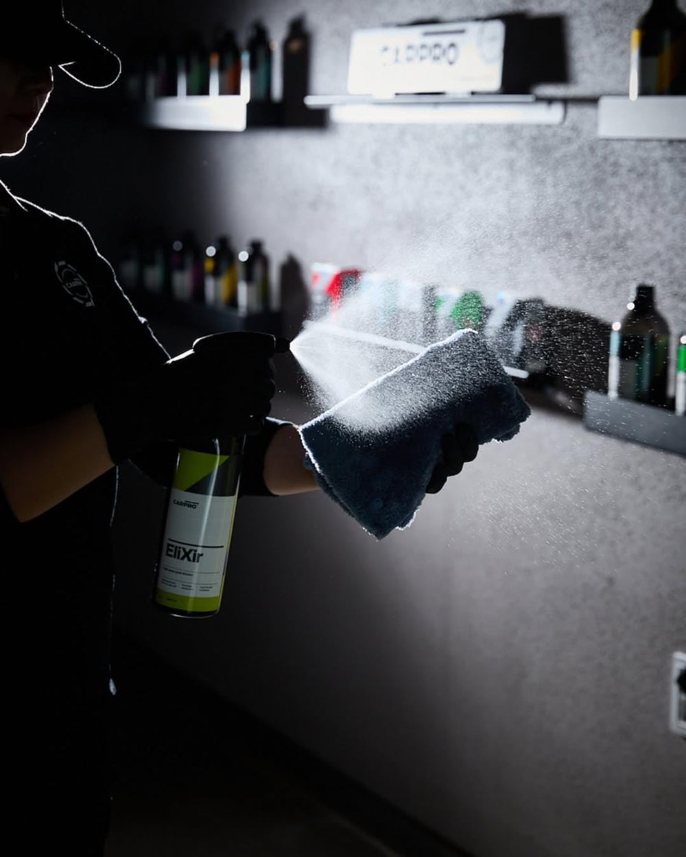 CARPRO EliXir Quick Detailer spray-on panel demonstrating hydrophobic surface beading